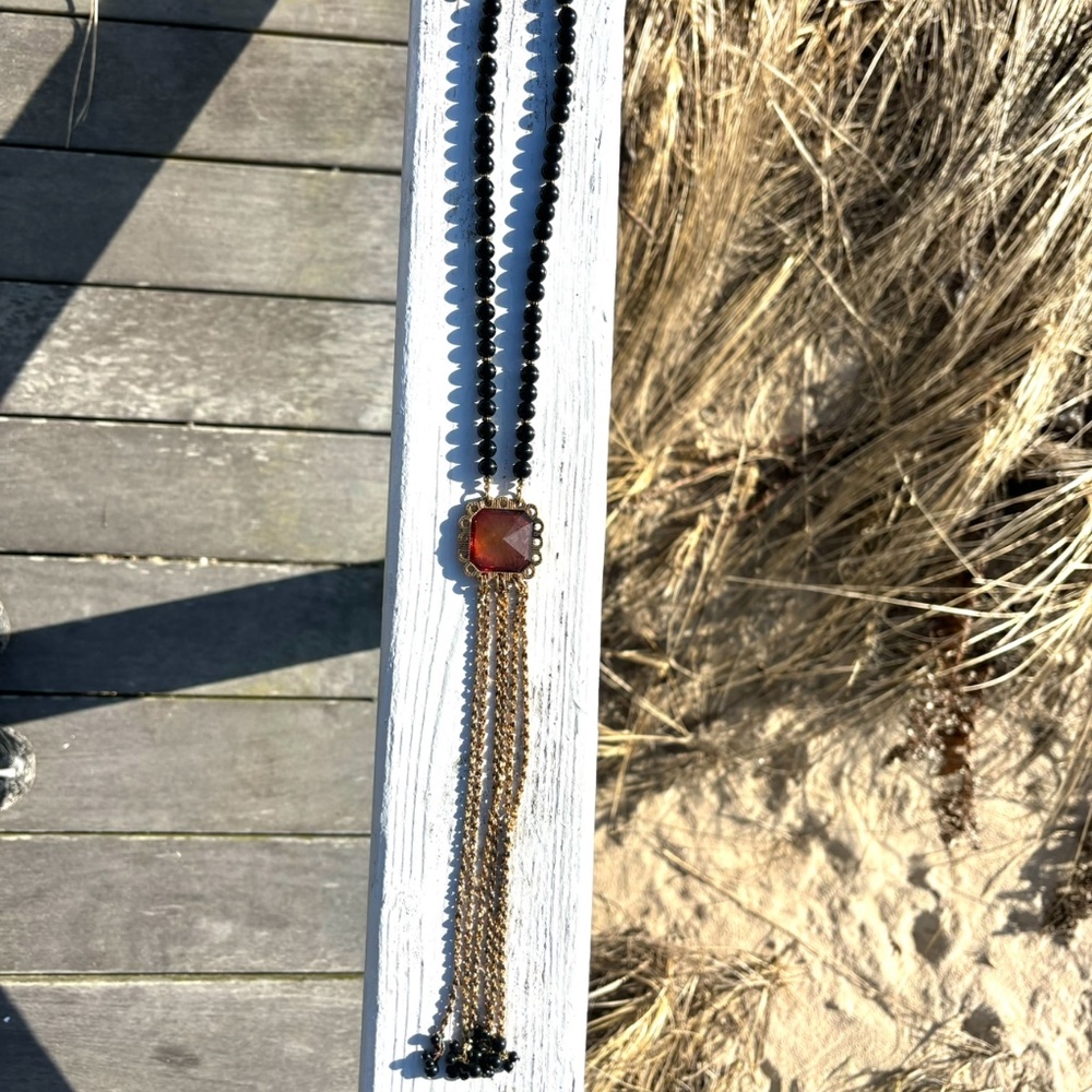 Betsey Johnson Necklace, Black Beads, Amber Colored Center, Gold Tassels.